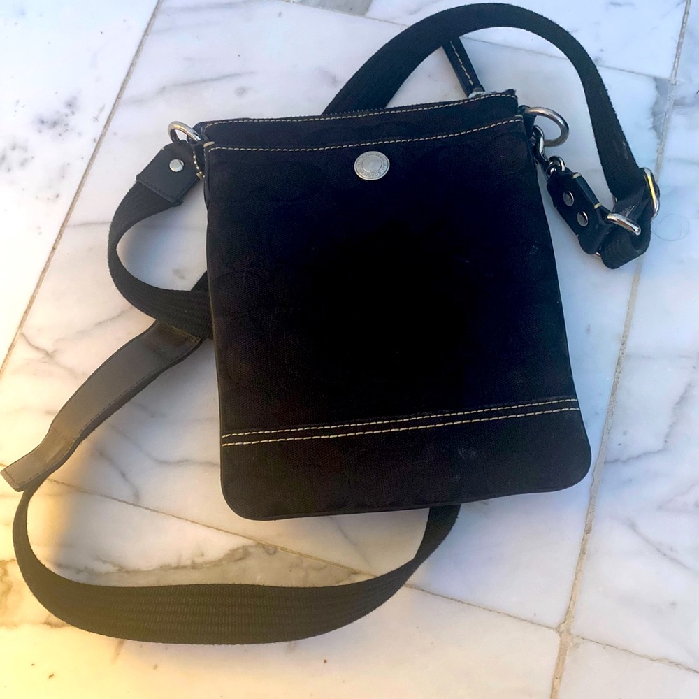 COACH Signature coated canvas and refined pebble leather